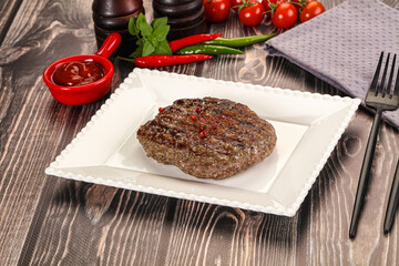 Grilled beef burger cutlet with sauce