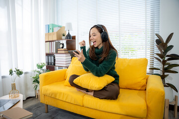 Joyful Moment: A person is engrossed in a world of personal content, fully embracing a moment of...