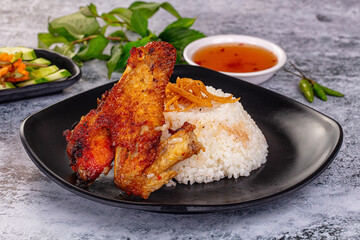 Spicy roasted chicken wing with rice