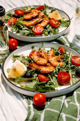 Bright and healthy Mediterranean salad with shrimp, olives and arugula — full of citrusy, peppery freshness.