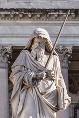 Statue of Saint Paul with sword and book at Papal Basilica of St. Paul Outside the Walls in Rome, Italy