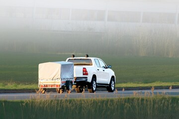 Automobile hauling trailer at twilight hour