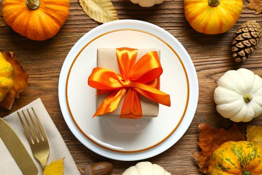 Thanksgiving Day or Harvest festival. Top view with plates, cutlery and autumn decorations
