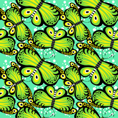  vibrant, seamless pattern features stylized green, black and orange butterflies with white accents, set against a bright yellow background dotted with white spots.