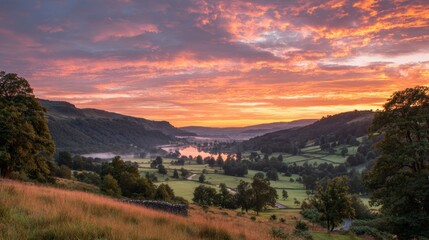 Fototapeta premium Orange and Pink Sunset Over a Valley Between Hills and Lake