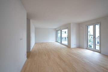 Interior shot of the unfurnished living room of a modern apartment
