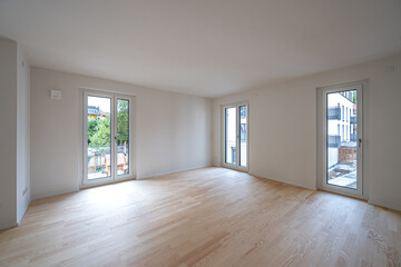 Interior shot of the unfurnished living room of a modern studio apartment