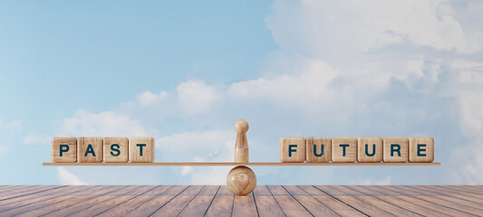Conceptual image of wooden blocks spelling “PAST” and “FUTURE” balanced on a seesaw,...