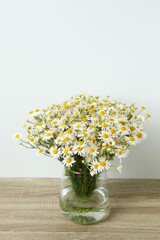 White background with bouquet of daisies, copy space