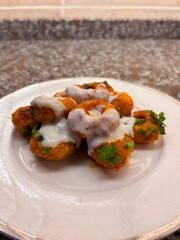 A Plate of Turkish Fellah Köftesi Drizzled with a Creamy Garlic Yogurt Sauce
