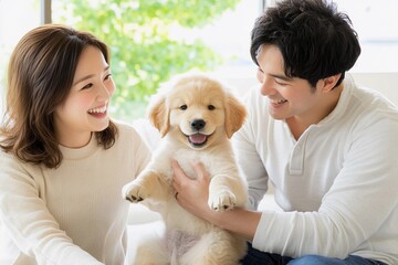 Couple Holding Smiling Golden Retriever Puppy