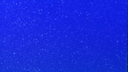 Microscopic air bubbles in blue water background