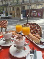 Delicious breakfast for two in a cafe. Breakfast table with healthy tasty ingredients. Coffee, bread, jam, orange juice on the table