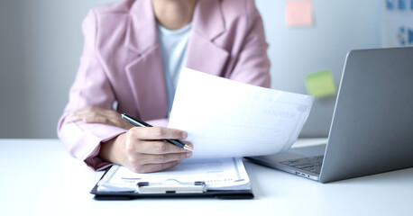 Business woman employer holding resume hiring recruit looking cv resume to hire candidates, analyzing information before job interview. Recruitment concepts