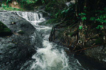 Serene Waterfall in Lush Greenery, North of Jetkot Area