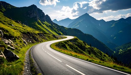 Fototapeta premium Winding Mountain Road Through Lush Green Hills