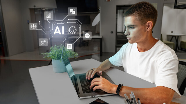 Young professional working with artificial intelligence concepts on a laptop in a modern office environment