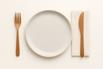 Minimalist table setting with ceramic plate and cutlery