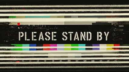 A retro television screen displaying the message "PLEASE STAND BY" with color bars. - Powered by Adobe