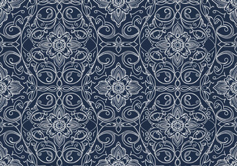 Fototapeta premium A luxurious seamless pattern, evoking traditional Indonesian Batik, displays intricate symmetrical floral and vine illustrations in fine white lines against a deep navy blue canvas.