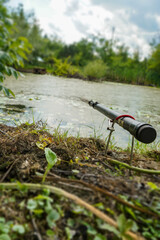 Summer fishing on the lake,
rod cast on the lake, overgrown lake