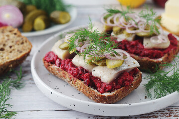 Scandinavian sandwiches with herring and beetroot