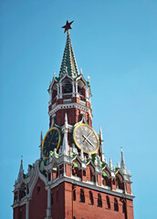 The chimes of the Spasskaya Tower on Red Square. The Moscow Kremlin tower against the blue sky.