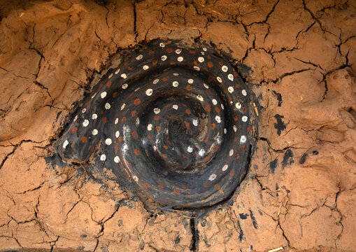 Snake on the muddy wall of a Senufo fetish house, Savanes district, Niofoin, Ivory Coast