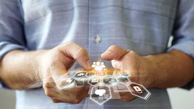 Man Using Smartphone with Social Media Graphics