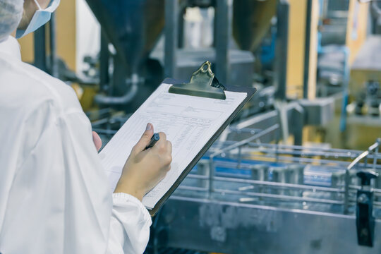Food hygiene staff worker check test products sterilize quality food factory conveyer belt line - Powered by Adobe
