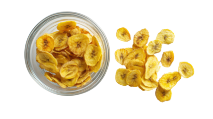 Dried banana chips in a glass jar, scattered chips on a white isolated background.