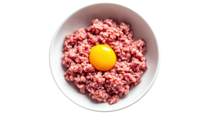 Fresh ground meat with a bright yellow egg yolk in a bowl on a white background.