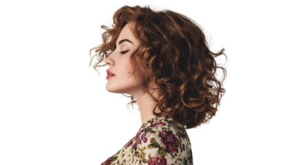 A woman with curly hair facing sideways, expressing tranquility and peace.
