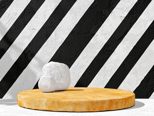 Textured White Stone Resting on Yellow Sandstone Platform with Black and White Striped Wall