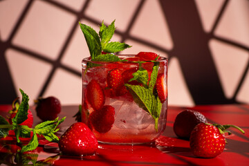 Strawberry mojito with vibrant red palette background