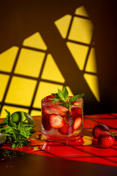 Strawberry mojito cocktail against a vibrant backdrop