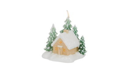 Snowy candle cottage with pine trees capturing winter's cozy charm