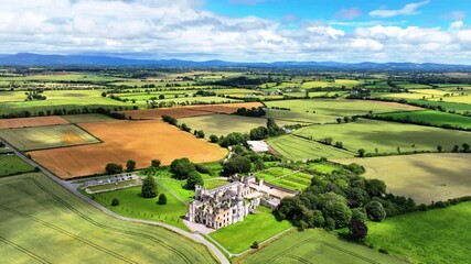 Aerial view of castle ruins cloud shadows passing over fertile land Ducketts Grove Carlow Ireland epic locations