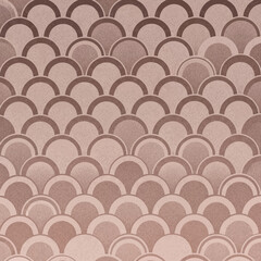 Repeating geometric Art Deco wave pattern in muted brown and pink tones for a sophisticated background