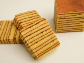 Layer cake, sliced, isolated on white background