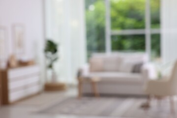 Blurred view of stylish furniture in living room. Interior design
