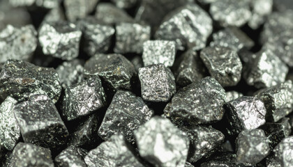Close-up view of a pile of shiny silver crystals representing thallium sources with ample copy space available