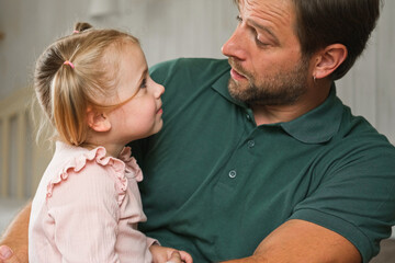 Happy Father Playing with Daughter. Three Years Baby Smiling, Laughing, Looking at Daddy. Man Showing Affection to Child. Candid Real Emotion. Beard Dad and Little Kid Girl. Authentic Family Lifestyle
