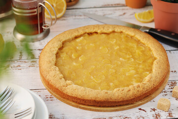 A tart with lemon marmalade served on the table	