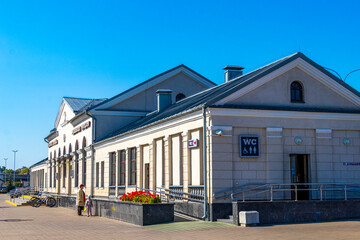 Brest Central train station welcome sign ticket building pedestrians Belarus.