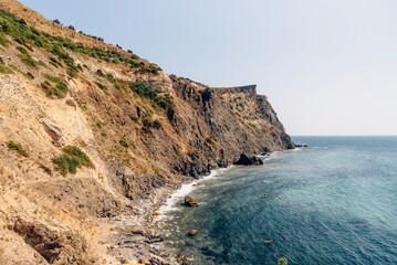 Fototapeta premium Cape Fiolent in Crimea, view of Black Sea and cliff in summer on sunny day