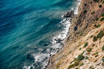 Fototapeta premium Cape Fiolent in Crimea, view of Black Sea and cliff in summer on sunny day