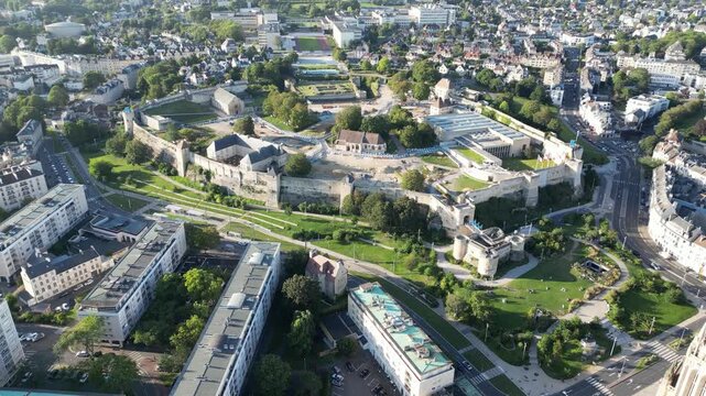 Aerial view of the Ch&acirc;teau de Caen, a majestic medieval castle, surrounded by lush greenery and modern architecture, exhibiting a blend of history and modernity, Caen, Normandy, France.
