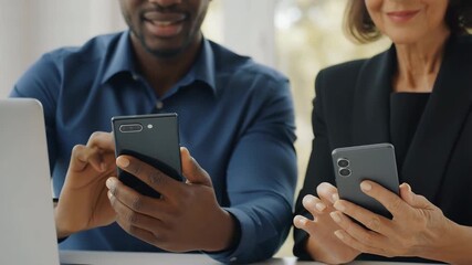 Business people using smartphones in office for communication, technology collaboration and digital connection at workplace meeting - Powered by Adobe