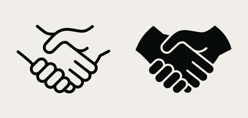 Obraz premium Two stylized handshake icons one outlined and one solid black